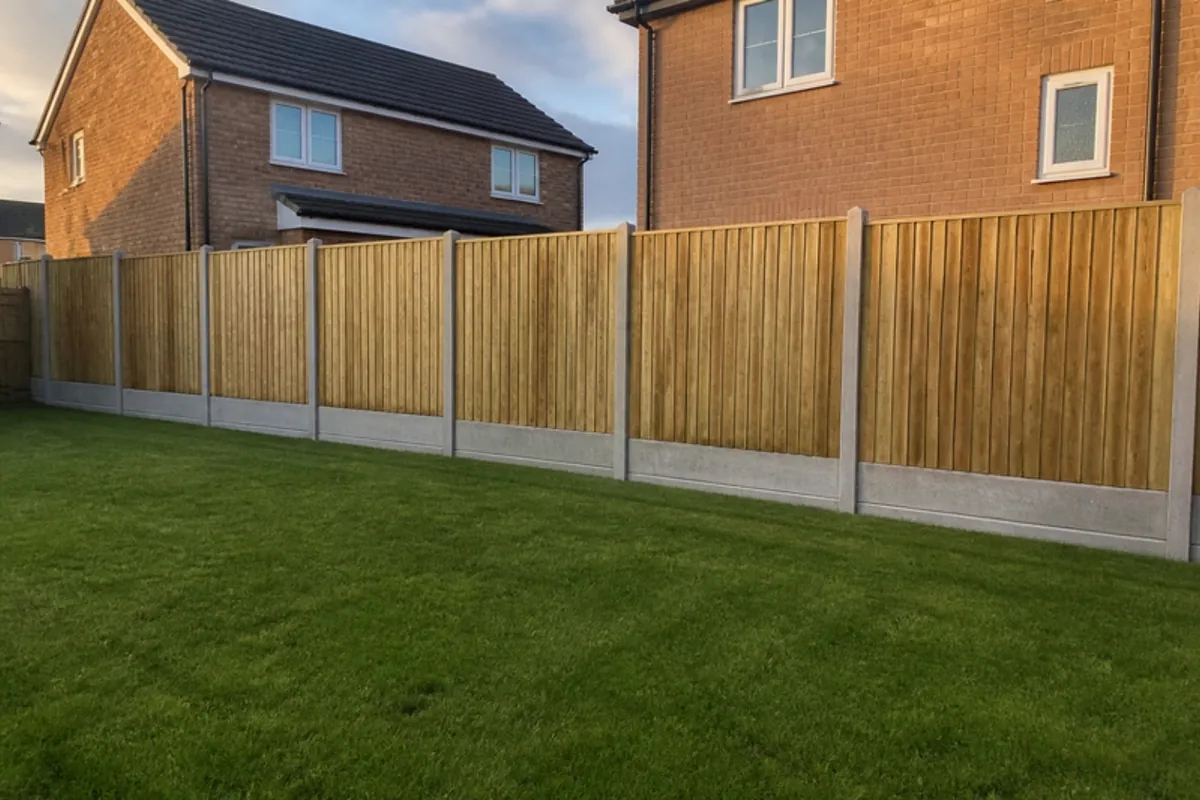 Closeboard on slotted concrete posts with concrete gravel boards in a new-build garden